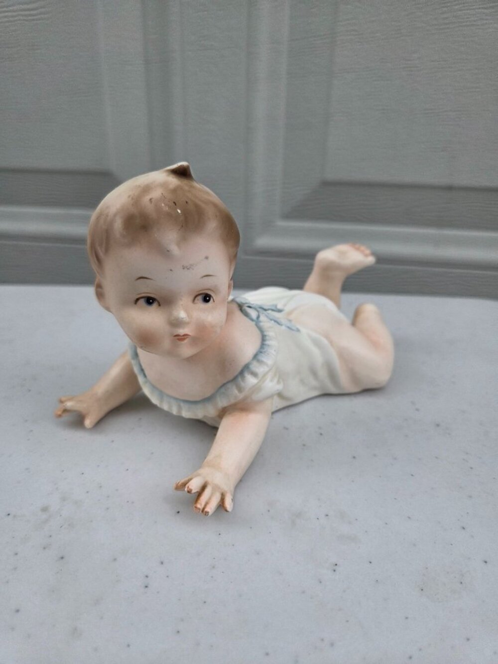Vintage Bisque Porcelain Crawling Piano Baby Figurine With Blue Accents 5.5" Lon